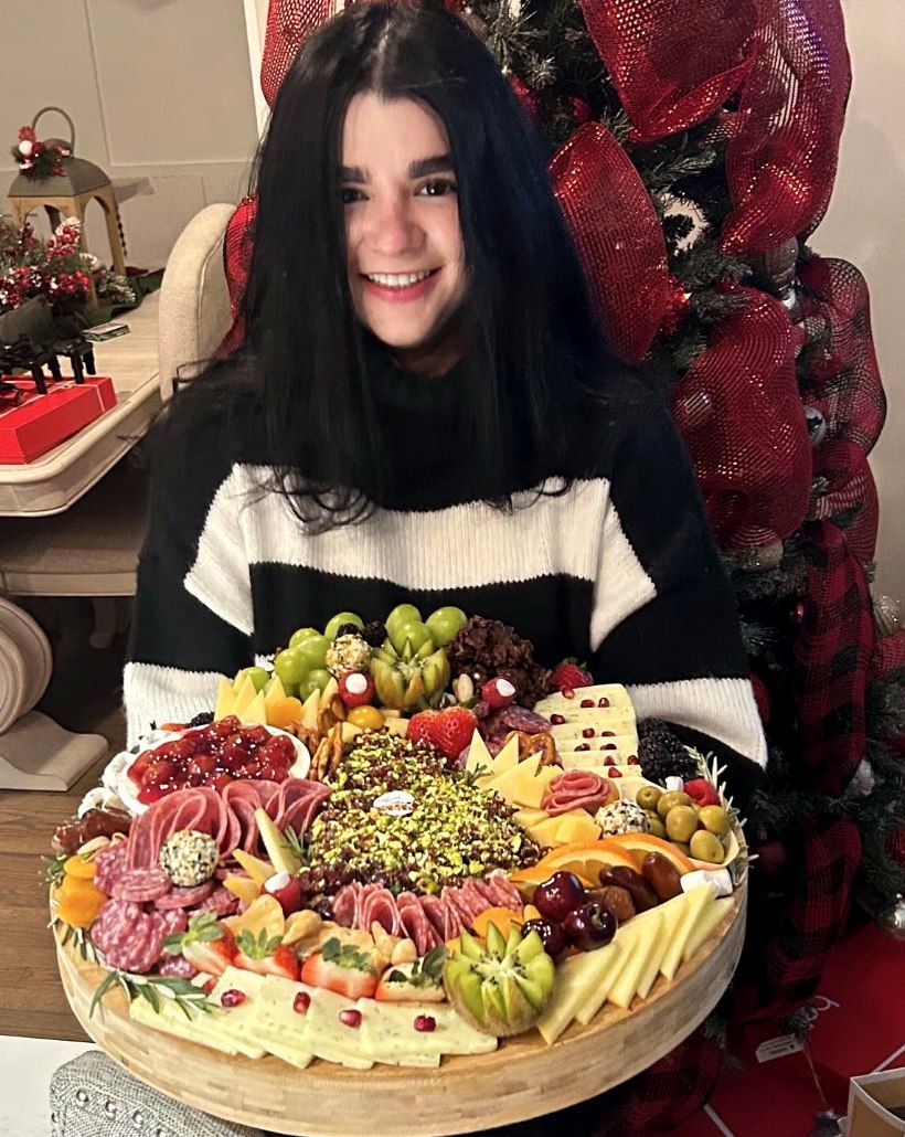 Dayana presenting a handcrafted La Traviata board